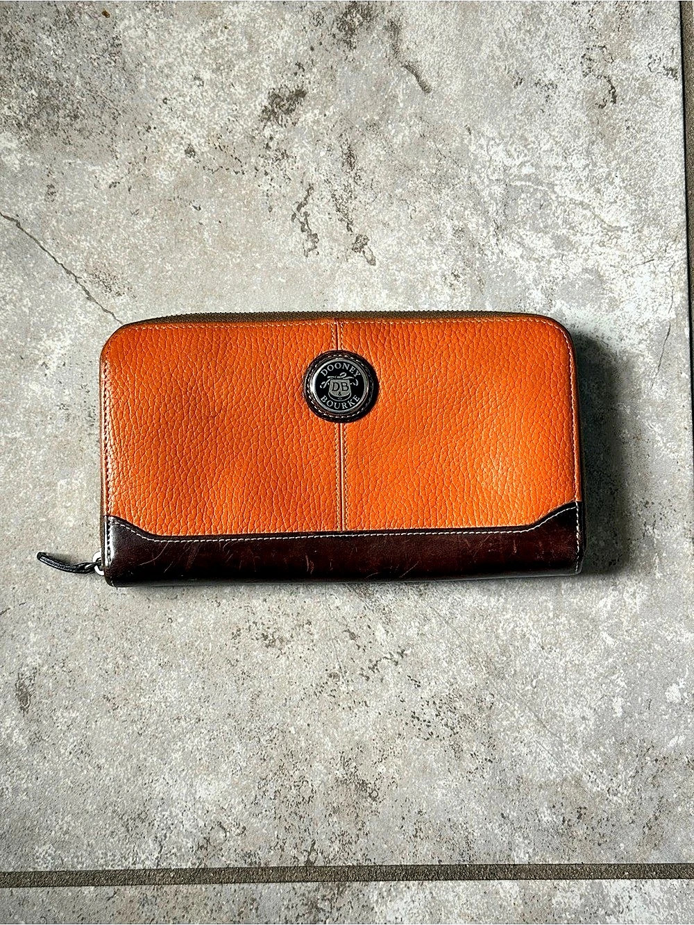 Dooney & Bourke Pebble Grain Zip-Around Wallet in Orange & Brown